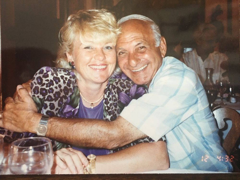 Eva and Gerry, cheek to cheek and laughing